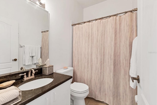 full bathroom featuring tile patterned floors, toilet, and vanity