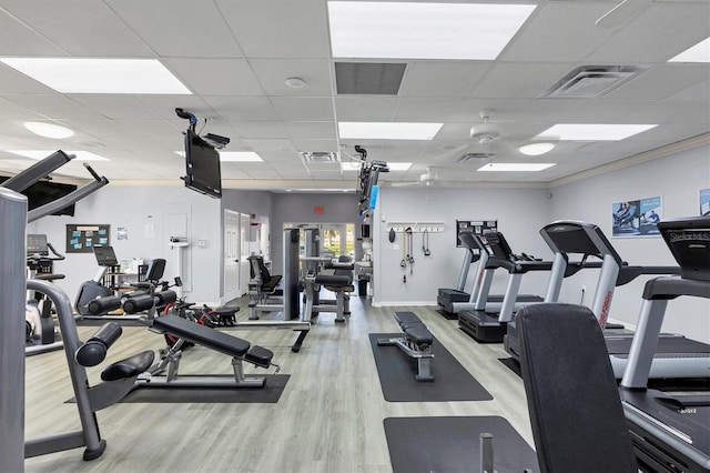 workout area with visible vents and wood finished floors