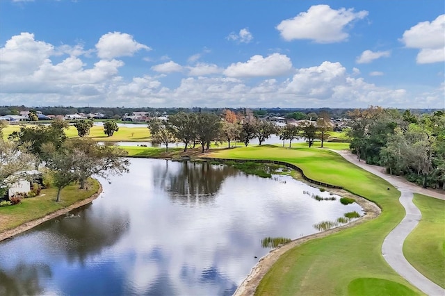 aerial view with golf course view and a water view