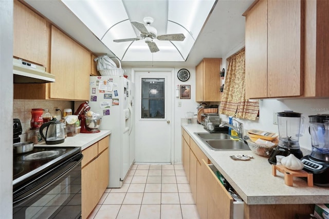 kitchen featuring under cabinet range hood, light countertops, white refrigerator with ice dispenser, electric range, and a sink