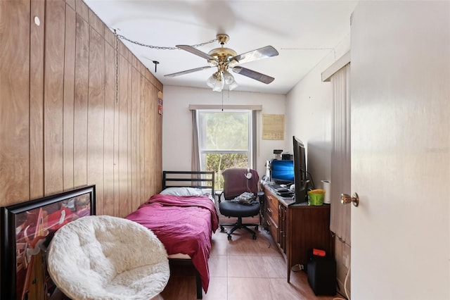 bedroom with light tile patterned floors and a ceiling fan