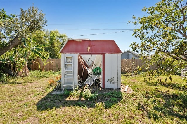 view of shed featuring a fenced backyard