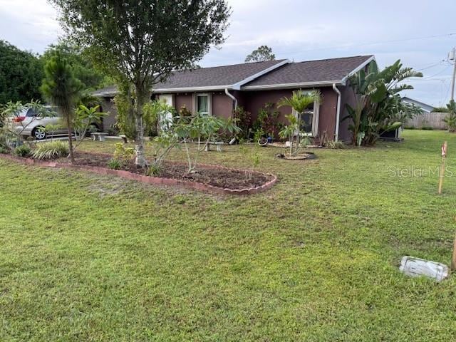 2678 Rock Creek Dr, Port Charlotte, FL 33948 - ranch-style home with a front lawn and stucco siding