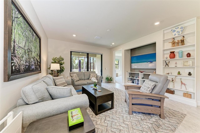 living room with built in features and recessed lighting