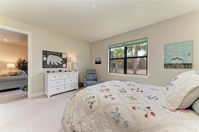 bedroom featuring carpet flooring and baseboards