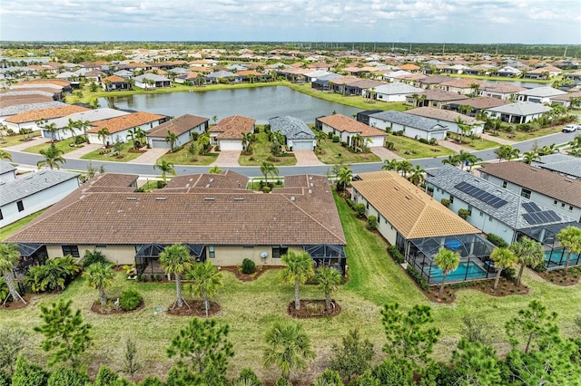 aerial view featuring a residential view and a water view