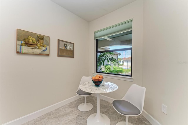 dining space with baseboards