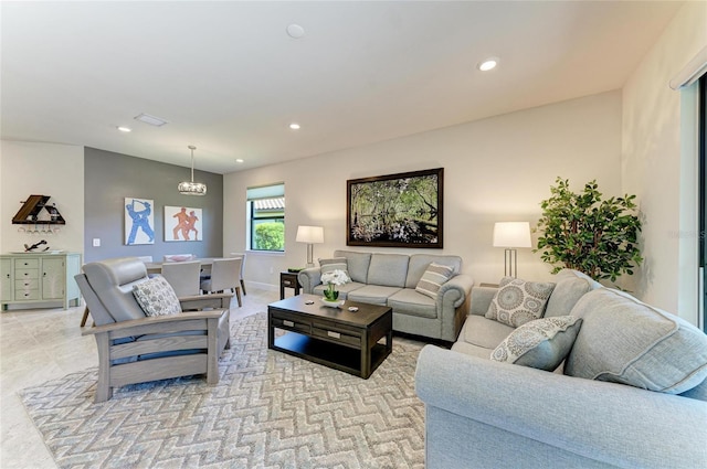 living area with visible vents, recessed lighting, and baseboards