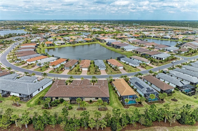 aerial view featuring a residential view and a water view