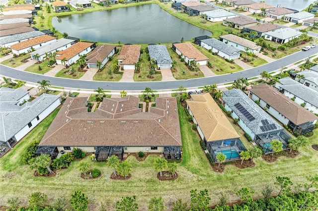 aerial view featuring a residential view and a water view