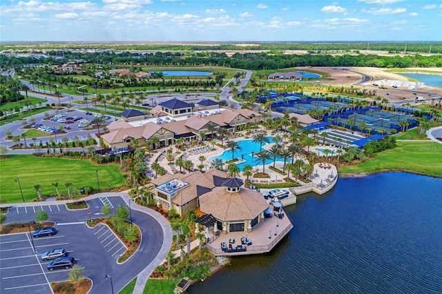 birds eye view of property with a water view