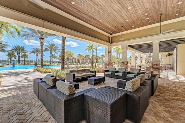 view of patio / terrace with an outdoor living space and a community pool