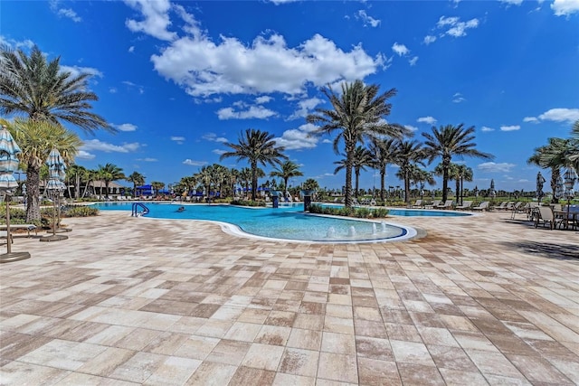 community pool featuring a patio area