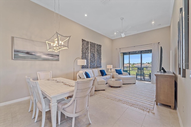 dining room featuring tile patterned floors, recessed lighting, ceiling fan with notable chandelier, and baseboards