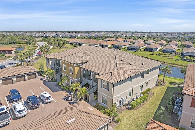 bird's eye view with a residential view and a water view