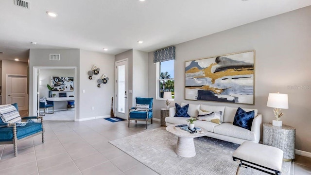 tiled living room featuring recessed lighting, visible vents, and baseboards