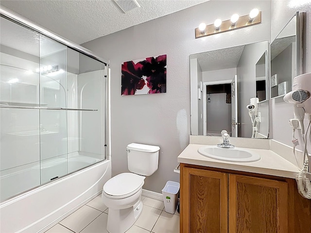 bathroom featuring tile patterned floors, visible vents, toilet, and a textured ceiling