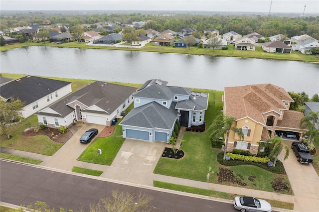 aerial view featuring a residential view and a water view