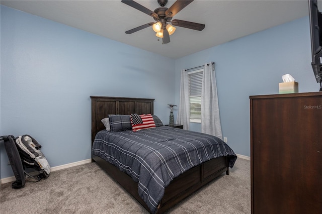 bedroom with baseboards, light carpet, and a ceiling fan