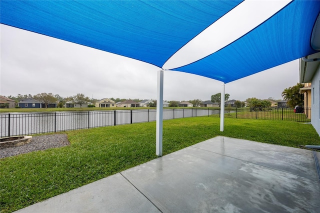 view of patio with a residential view and a fenced backyard