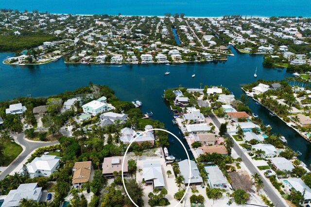 aerial view with a residential view and a water view