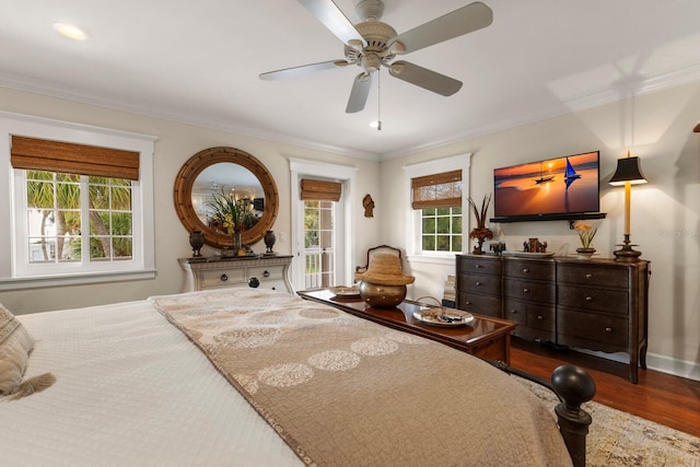 bedroom with a ceiling fan, wood finished floors, and ornamental molding