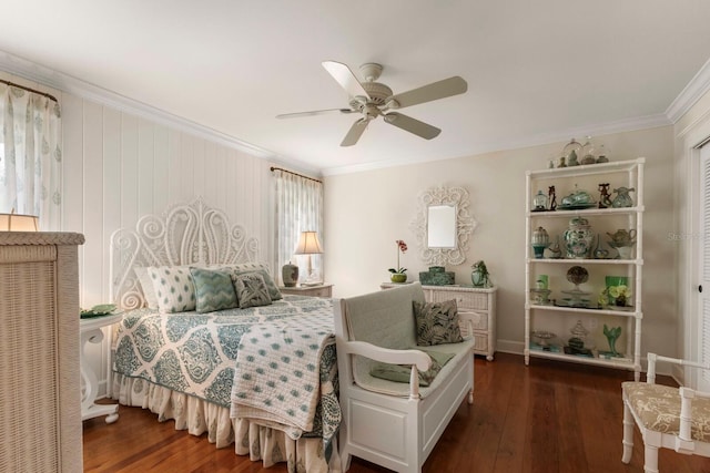 bedroom with ceiling fan, wood finished floors, and ornamental molding