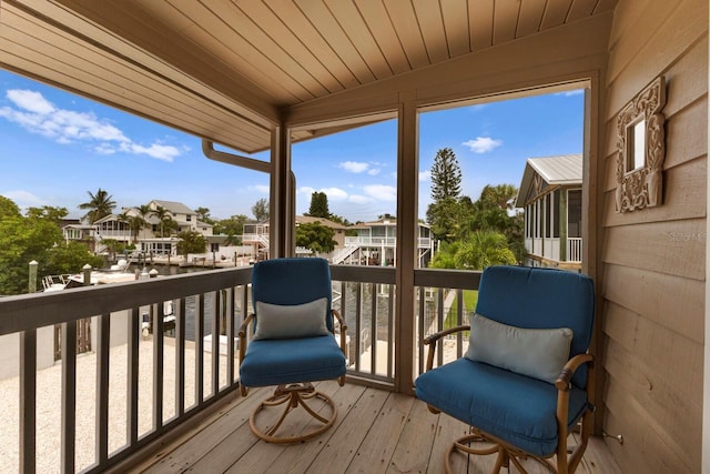 wooden deck featuring a residential view