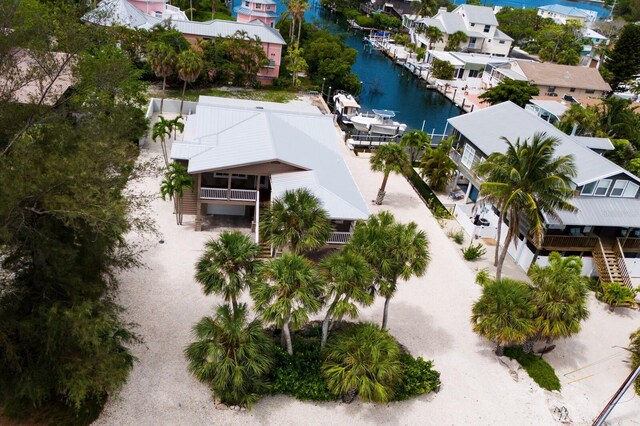 birds eye view of property with a residential view and a water view