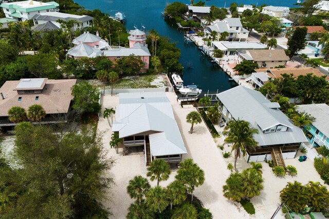 bird's eye view featuring a residential view and a water view