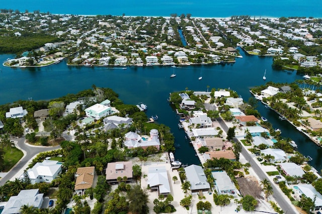 bird's eye view featuring a residential view and a water view