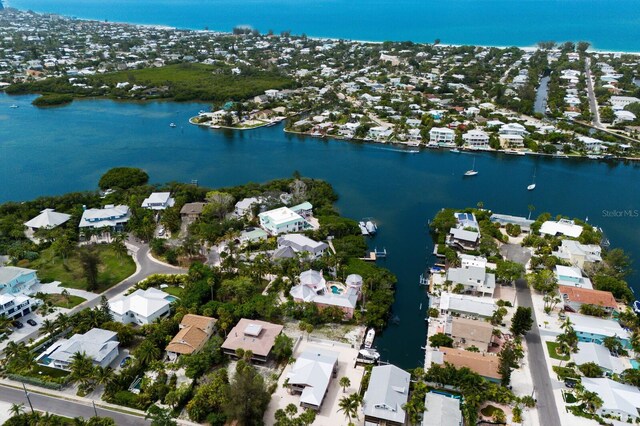 drone / aerial view featuring a residential view and a water view