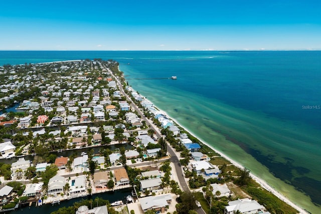 drone / aerial view featuring a water view and a residential view