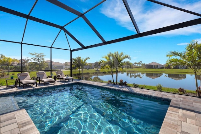 view of swimming pool with a patio area, glass enclosure, and a water view