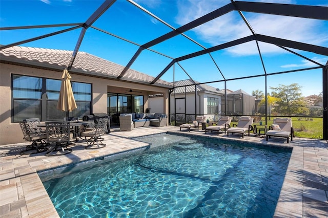 pool with an outdoor living space, a lanai, a ceiling fan, and a patio area