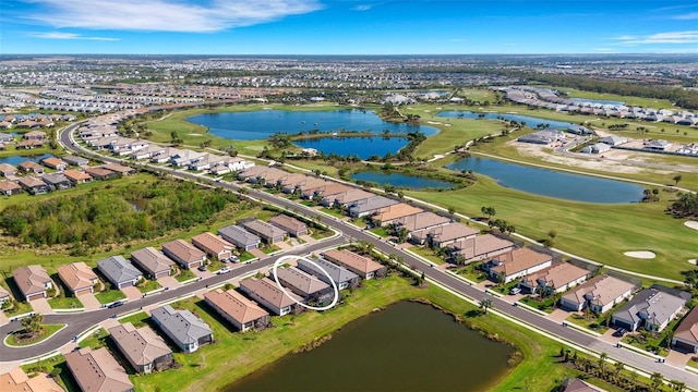 aerial view featuring a residential view, view of golf course, and a water view