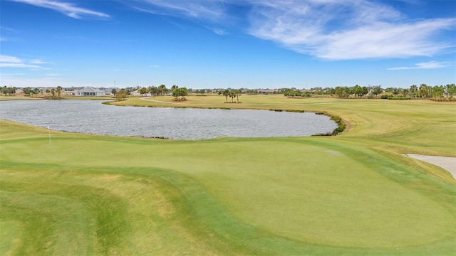 view of property's community with a water view and view of golf course