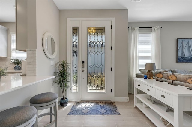 foyer featuring plenty of natural light