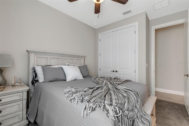 bedroom with visible vents, a closet, and a ceiling fan