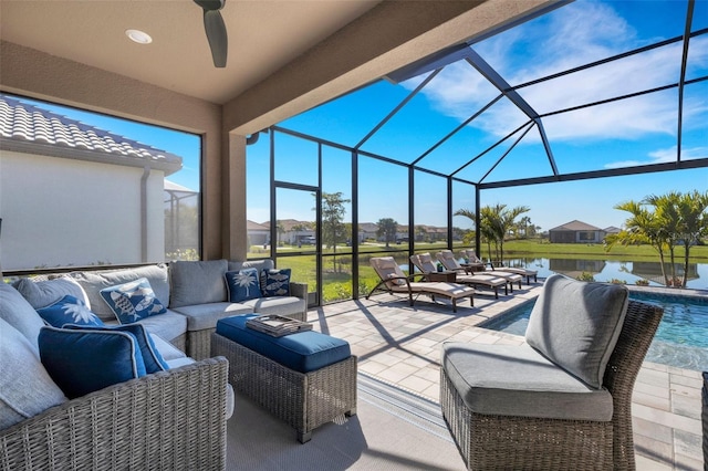 view of patio featuring an outdoor pool, glass enclosure, an outdoor hangout area, and a water view