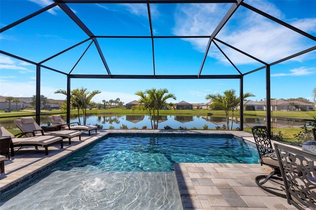 pool with glass enclosure, a water view, and a patio area