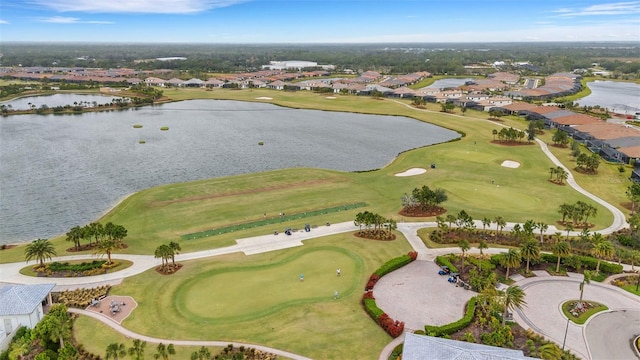 birds eye view of property featuring a residential view, golf course view, and a water view