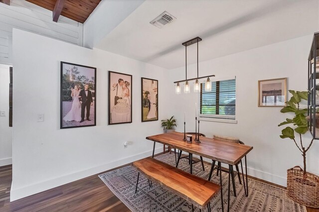 dining space with visible vents, baseboards, and wood finished floors