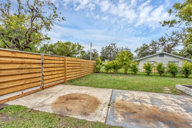 view of yard featuring a patio and a fenced backyard