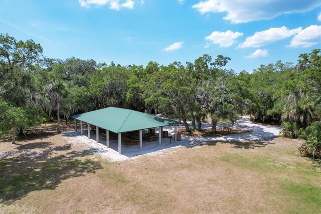 drone / aerial view featuring a view of trees