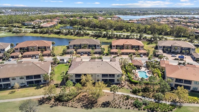 bird's eye view featuring a water view and a residential view