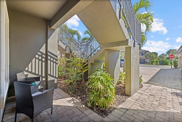 view of patio featuring stairway