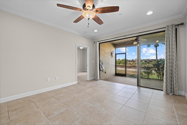 empty room with crown molding, a ceiling fan, and baseboards