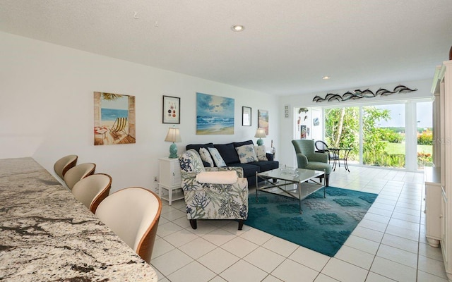 living area with light tile patterned floors and recessed lighting