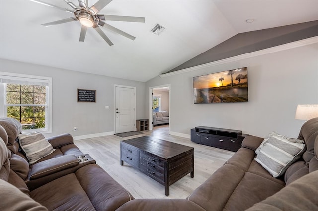 living room with baseboards, visible vents, lofted ceiling, ceiling fan, and light wood-type flooring